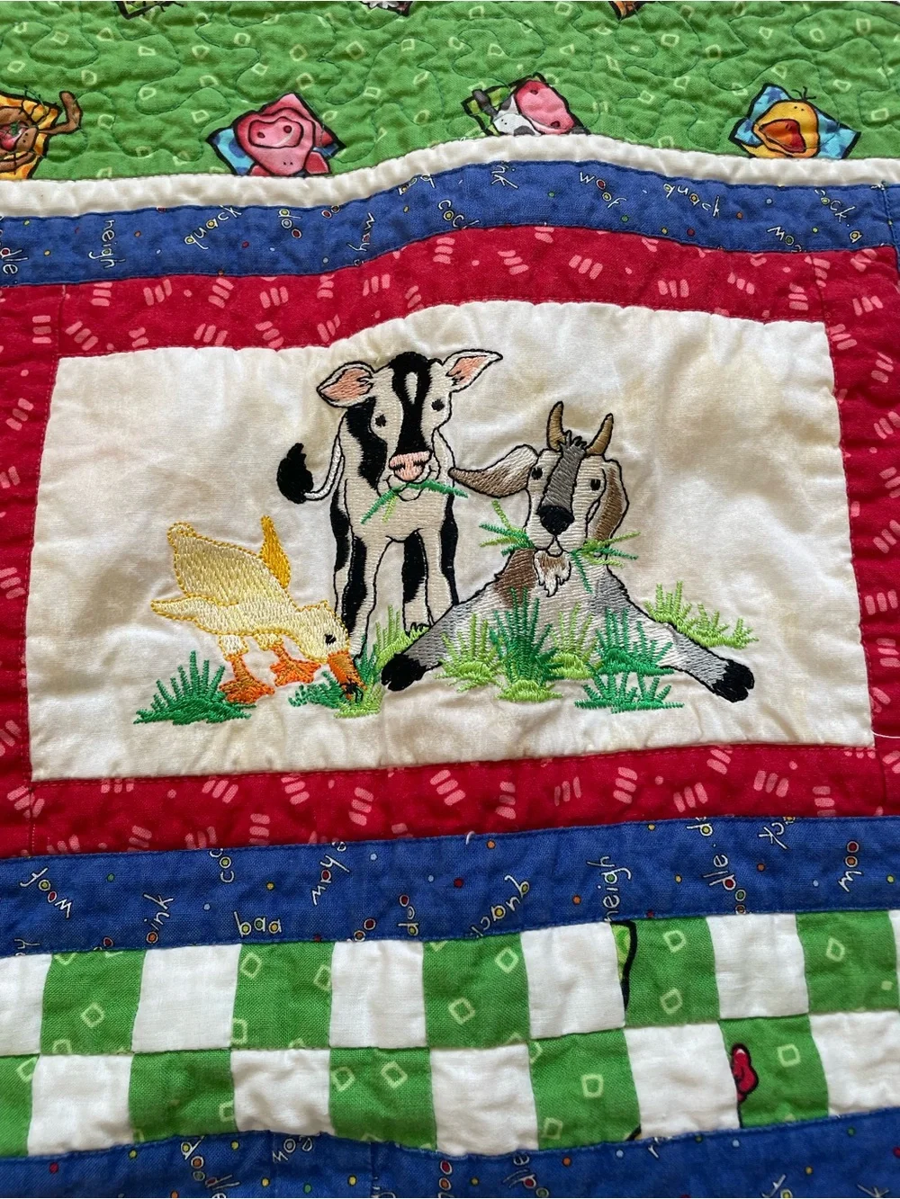 Quack, Moo, Oink quilt with farm animals and 'Quack, Moo, Oink'